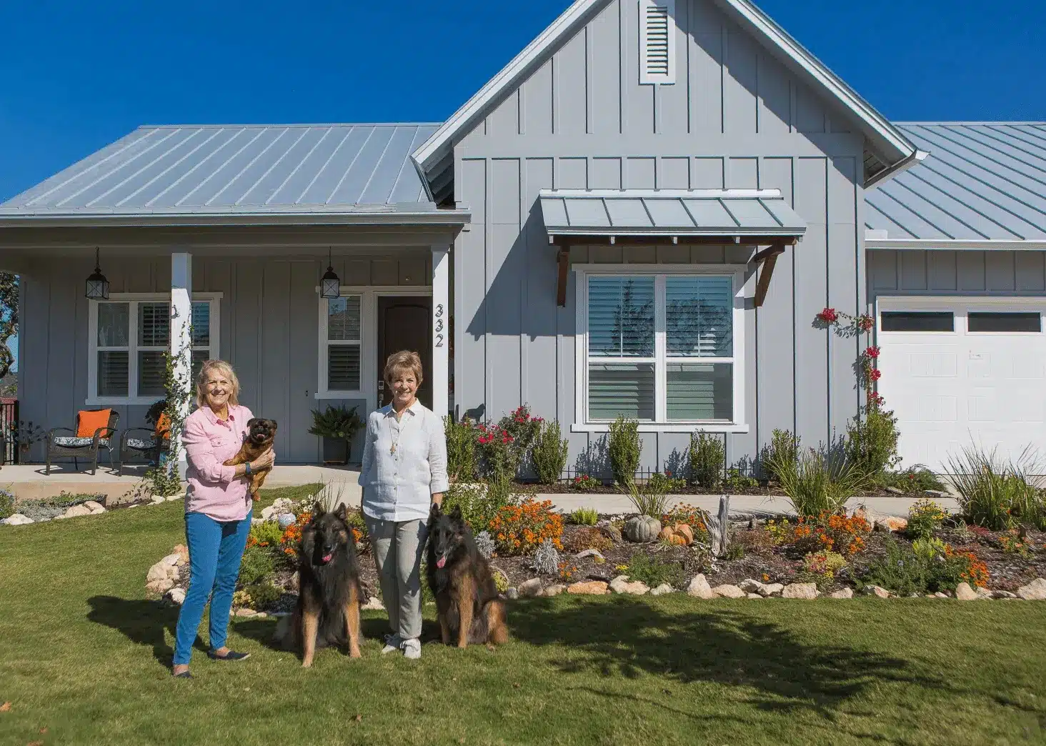 KT Homeowner Porch Portraits-1 People standing in front of home in Kissing Tree