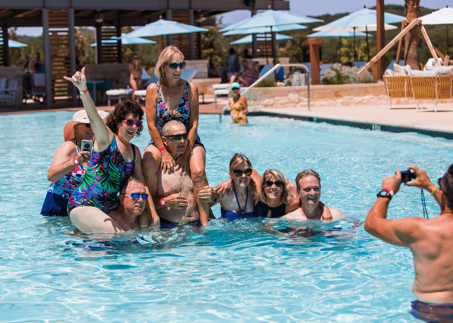 Residents together in the swimming pool taking a group photo
