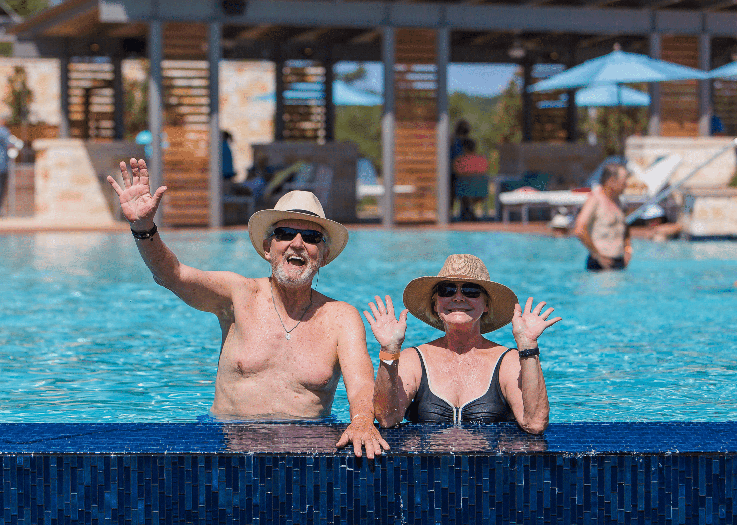 Couple Posing for a photo from the swimming pool