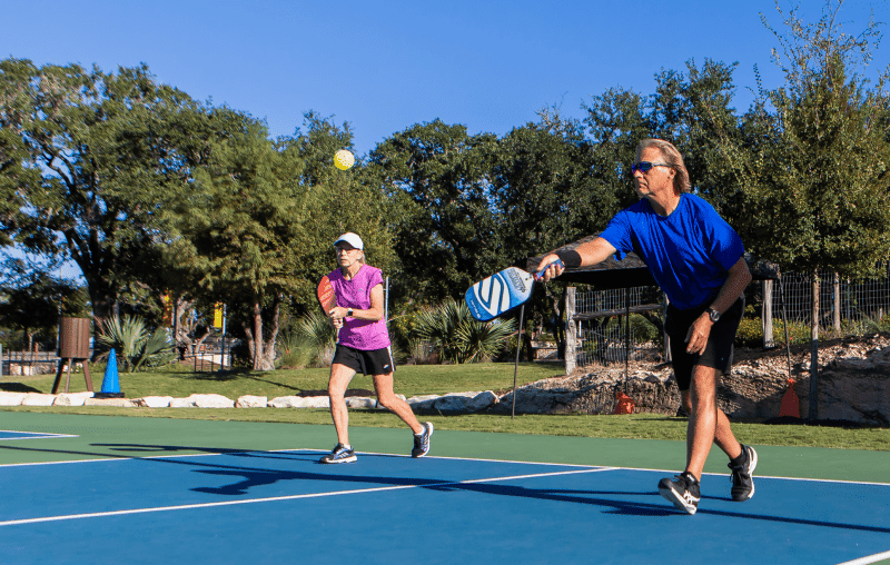 pickleball game outside on a sunny day