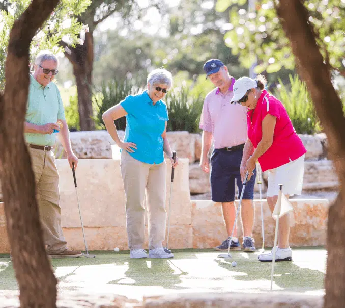 55+ Residents Playing Golf Together in KT