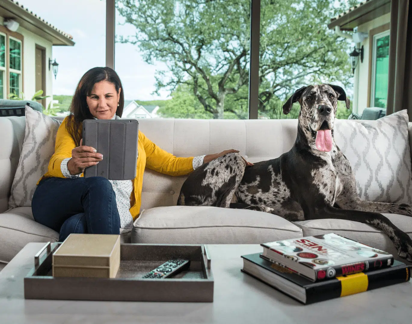 Woman Checking Her Finances with Her Dog