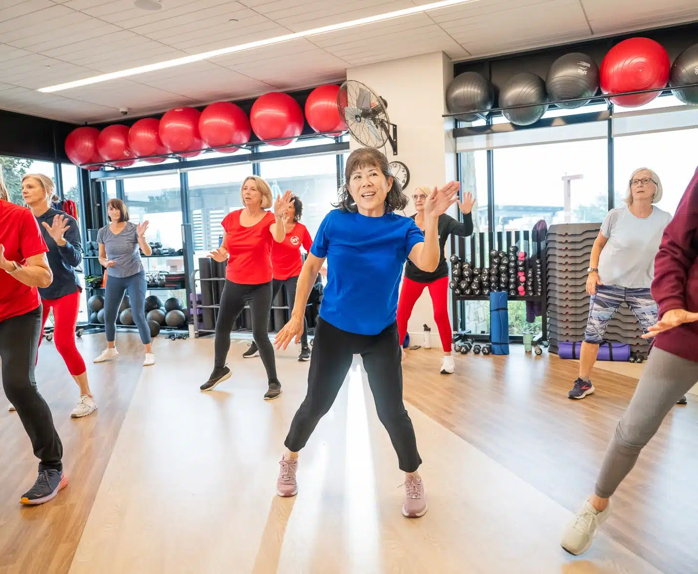 person in fitness class at kissing tree
